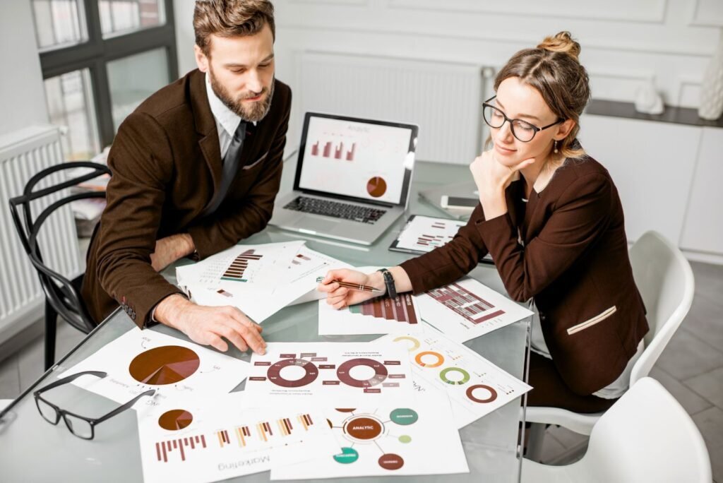 CRO experts review performance data and charts, strategizing A/B testing to optimize conversion rates and ROI.