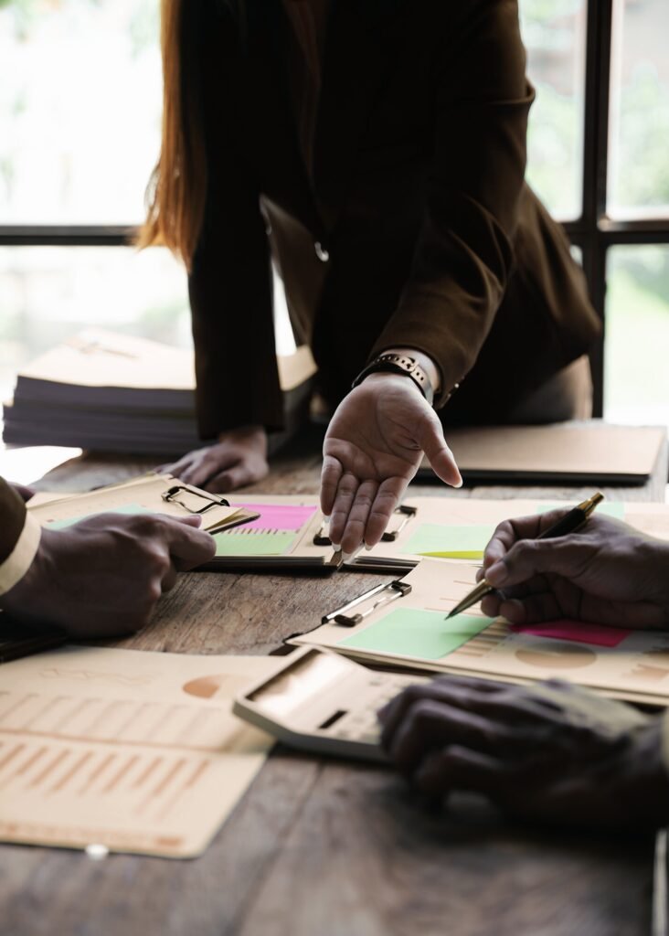 Experts discuss Google Ads strategy, reviewing charts, making calculations, and planning campaigns for business growth.