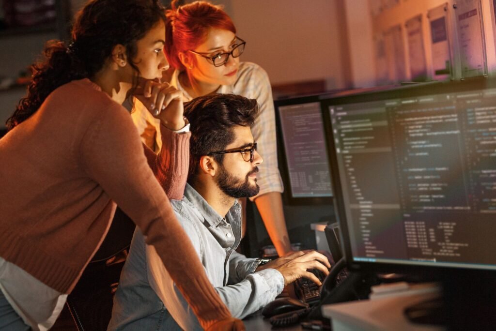 Dedicated web development team in Bangkok collaborating on code, crafting lightning-fast, SEO-ready websites with clean code.