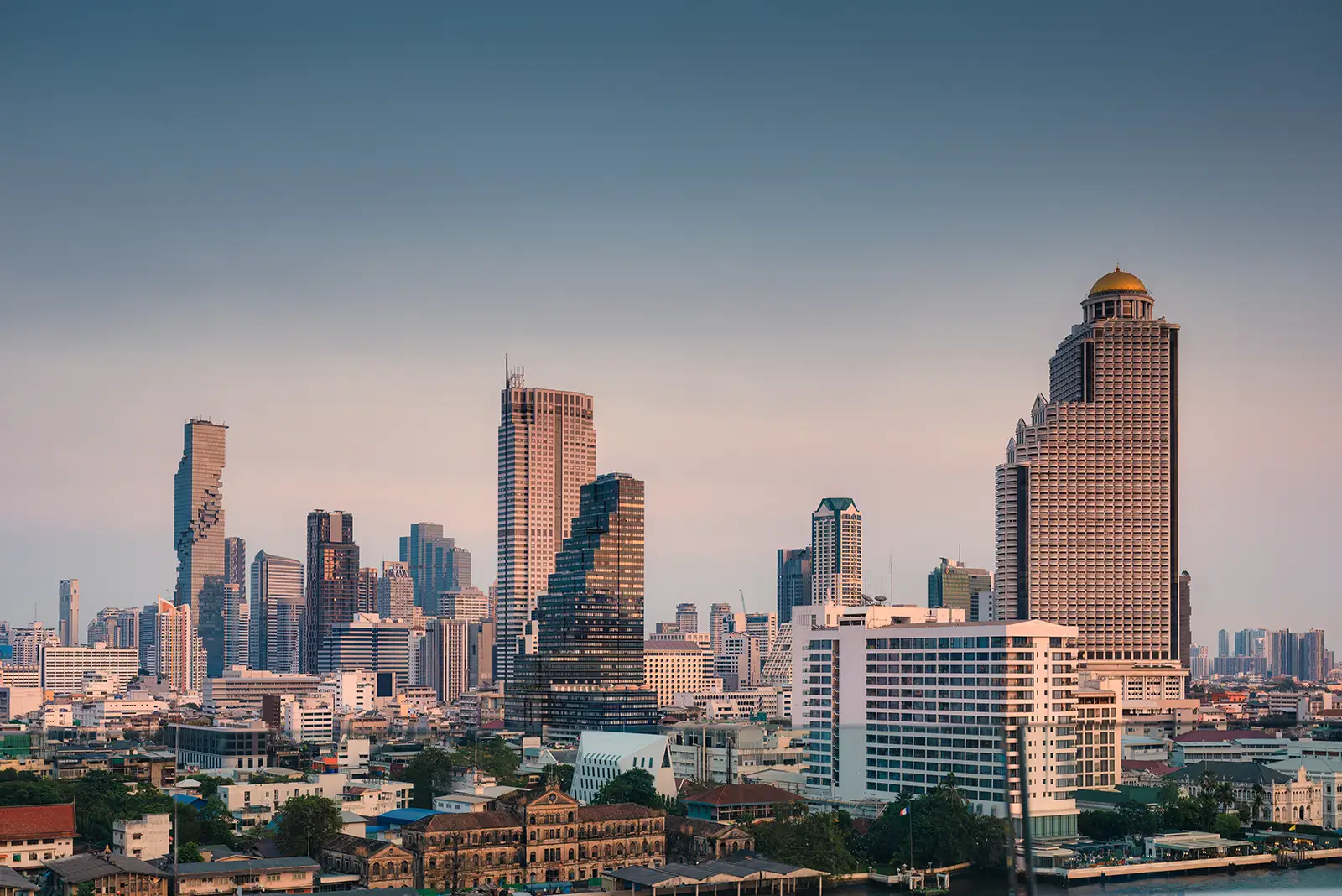 Vibrant Bangkok city skyline at sunset, featuring modern skyscrapers like MahaNakhon, perfect for digital marketing.