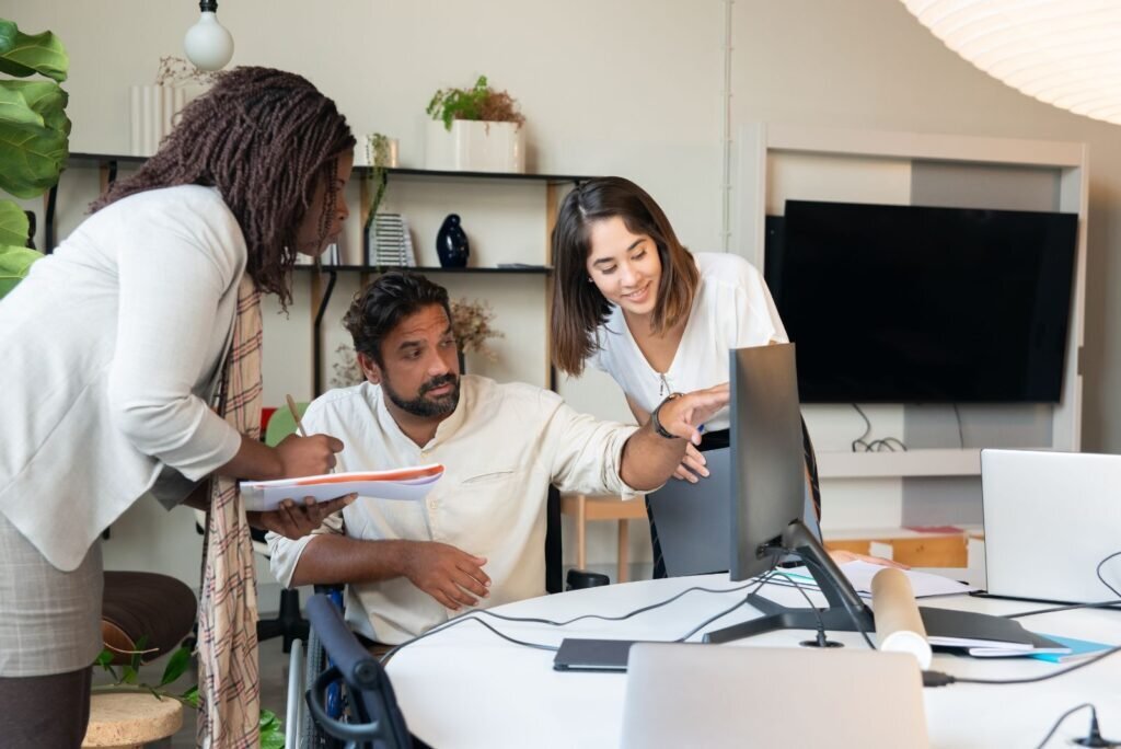 Our expert team collaborates on a computer, reviewing data for high-quality link building and SEO ranking strategies.