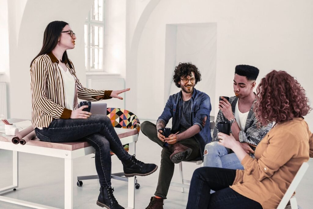 Diverse team of four professionals collaborating in a bright office, strategizing reliable white label SEO solutions.