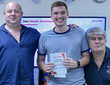 Move Ahead Media team members celebrating a digital marketing expert's 1-year anniversary, reflecting our valued team.