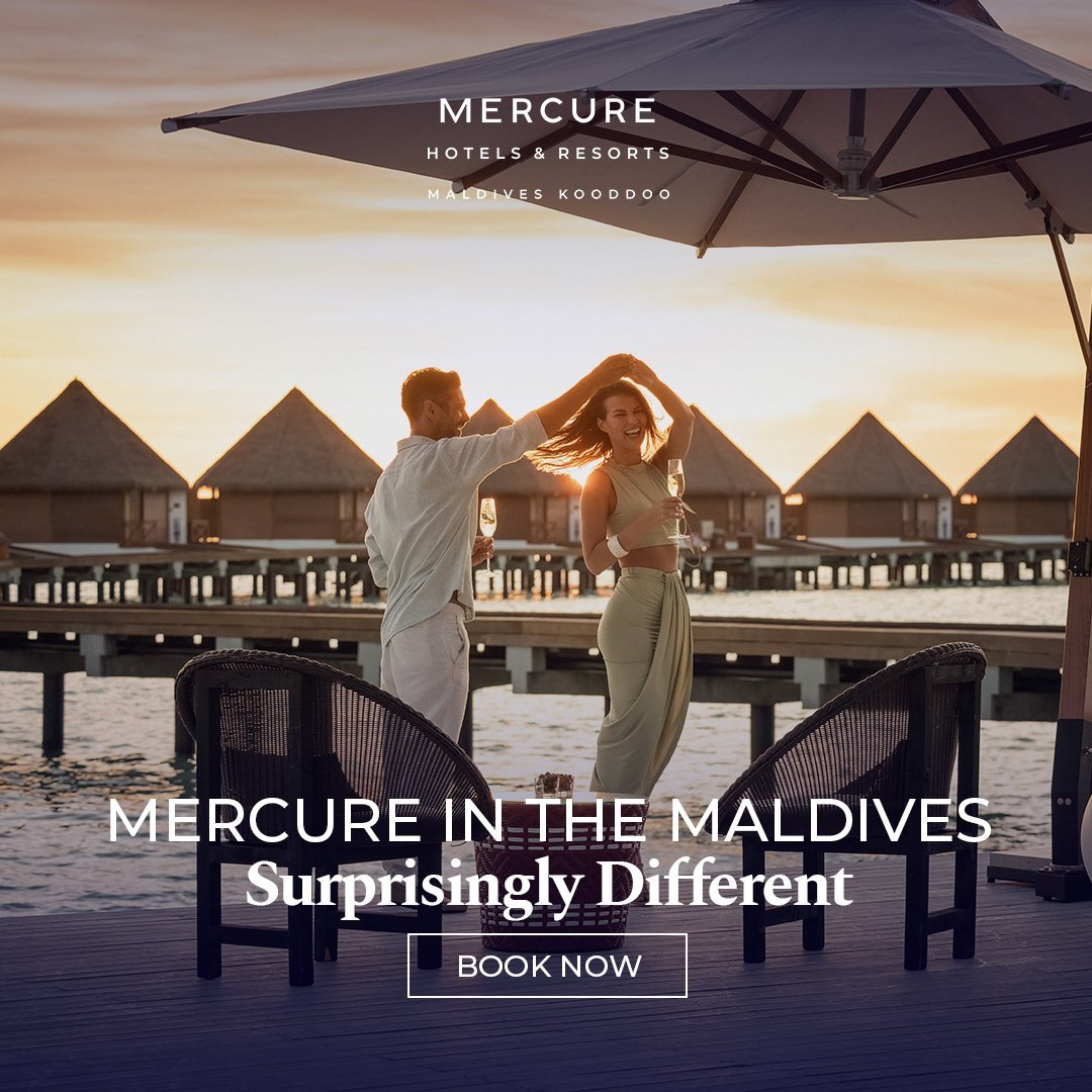 Vibrant sunset at a Maldives luxury resort, a couple dancing by overwater bungalows, exemplifying hospitality marketing success.